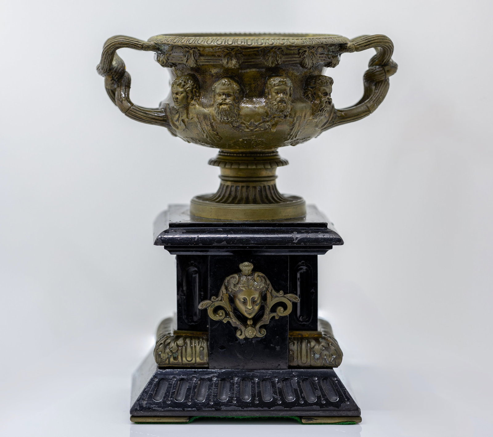 WARWICK STYLE BRONZE VASE: Description: Warwick style vase on the stone display Material: Bronze Measurments: 10" x 8 1/2" x 6" Condition report: Refer to photos for more information