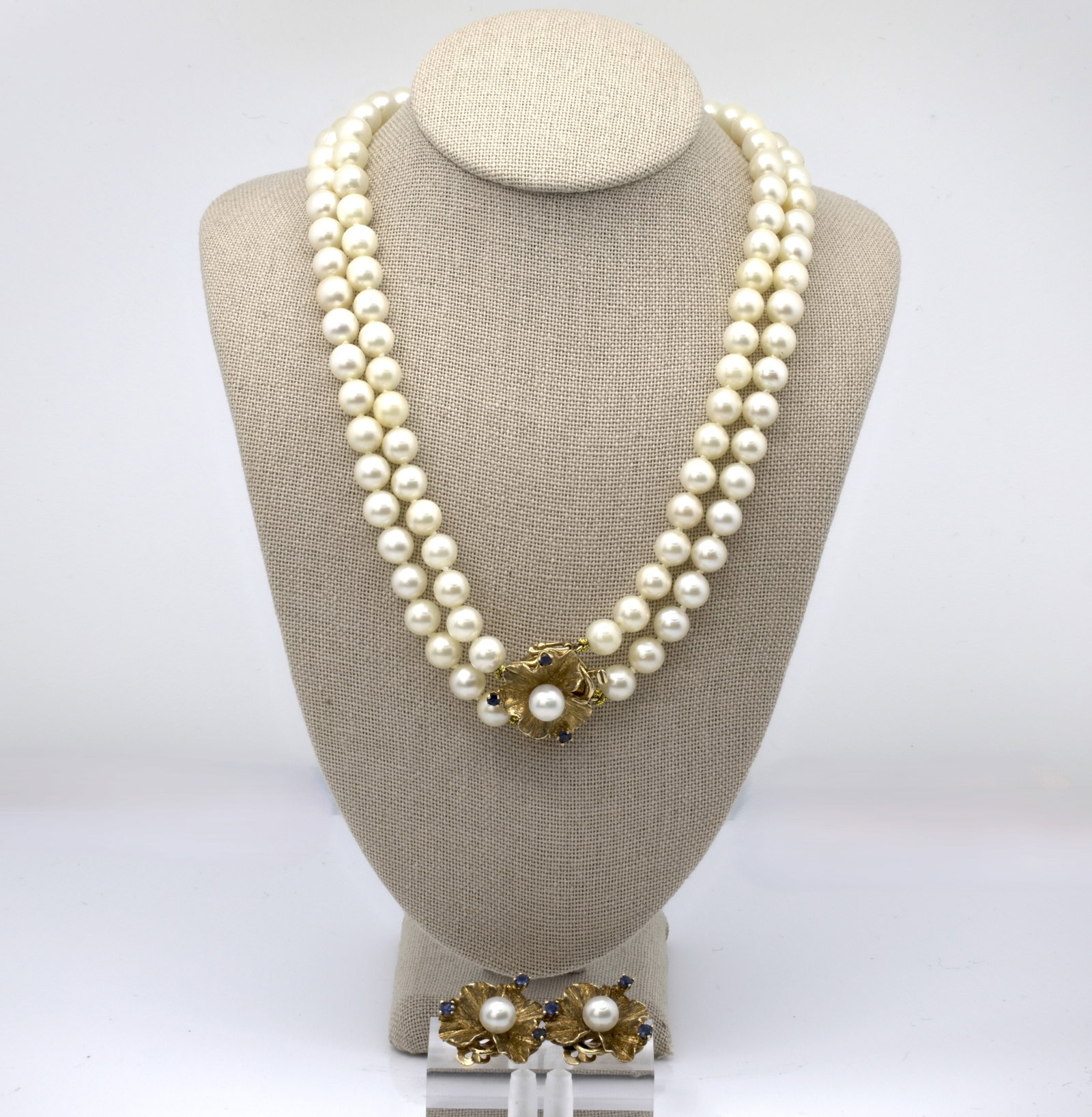14K GOLD PEARL SET OF NECKLACE & EARINGS WITH SAPPHIRES: Description: Pearl necklace , gold clasp, with earings. Metal: 14k gold Gemstones: Sapphires 0.55ct Pearls size: 7mm Weight:62.4g Lenght:17" necklace | 3/4 earings