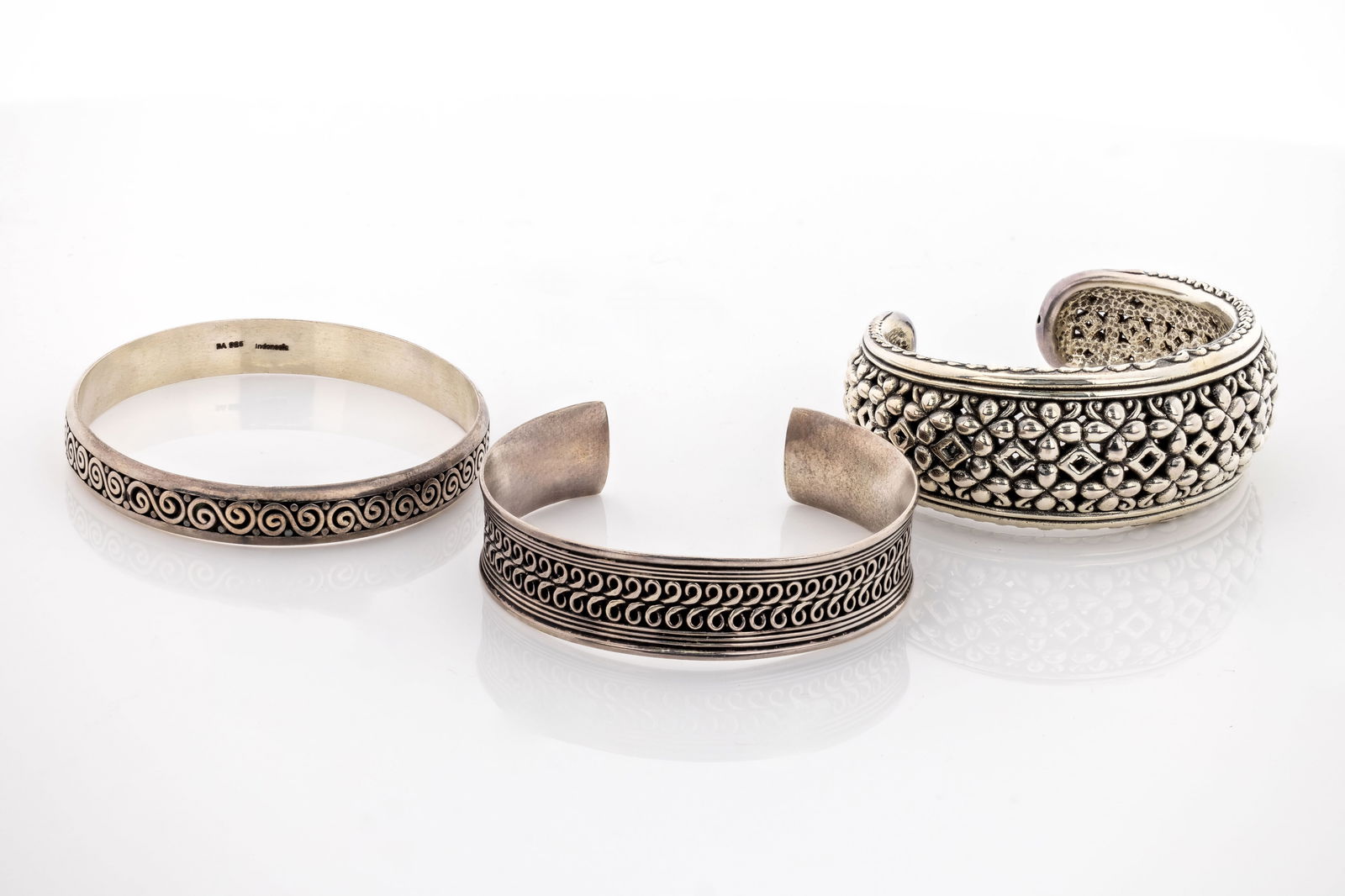 Three Cuff Bracelet Set, 925 Sterling Silver, Indonesia: Description: Each with distintic Balinese-inspired designs. Handcrafted, reflicting the artistry and cultural heritage of balinese silversmiths.the open cuff design allows for adjustable sizing, and t