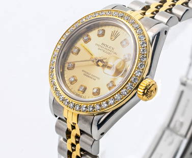 Rolex Lady Datejust 26mm 18K Yellow Gold Steel White Diamond Dial & Diamond Bezel 69173: Brand: Rolex Collections: Date just Model: 69173 Movement: Automatic Size: 26mm Case Material: Stainless Steel and 18K Yellow Gold Bezel: 18K Yellow Gold, Champagne Diamond Dial, Custom Diamond Bezel