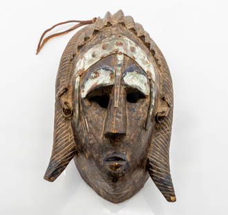 The African Helmet is Maraka Tribal Carved Wooden Mask with Metal Accents: Title:&nbsp;African Maraka (Marka) or Bamana Tribal Carved Wooden Helmet Mask with Metal Accents Description:&nbsp;Hand-carved wooden helmet mask attributed to the Maraka (Marka) or Bamana peoples of