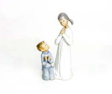 Lladro, Spain, Children Praying Porcelain Figure: Artist, Year, Title: Lladro (Spain), Children Praying, Model No. [Unspecified], Late 20th CenturyOrigin: Valencia, Spain Medium: Glazed porcelain