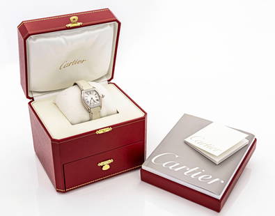 Cartier Roadster 18K White Gold Factory Diamond Ladies Watch WE500260: Description: A luxurious and elegant Cartier Roadster ladies wristwatch crafted in solid 18K white gold, featuring a tonneau-shaped case with factory-set round brilliant-cut diamonds adorning the beze