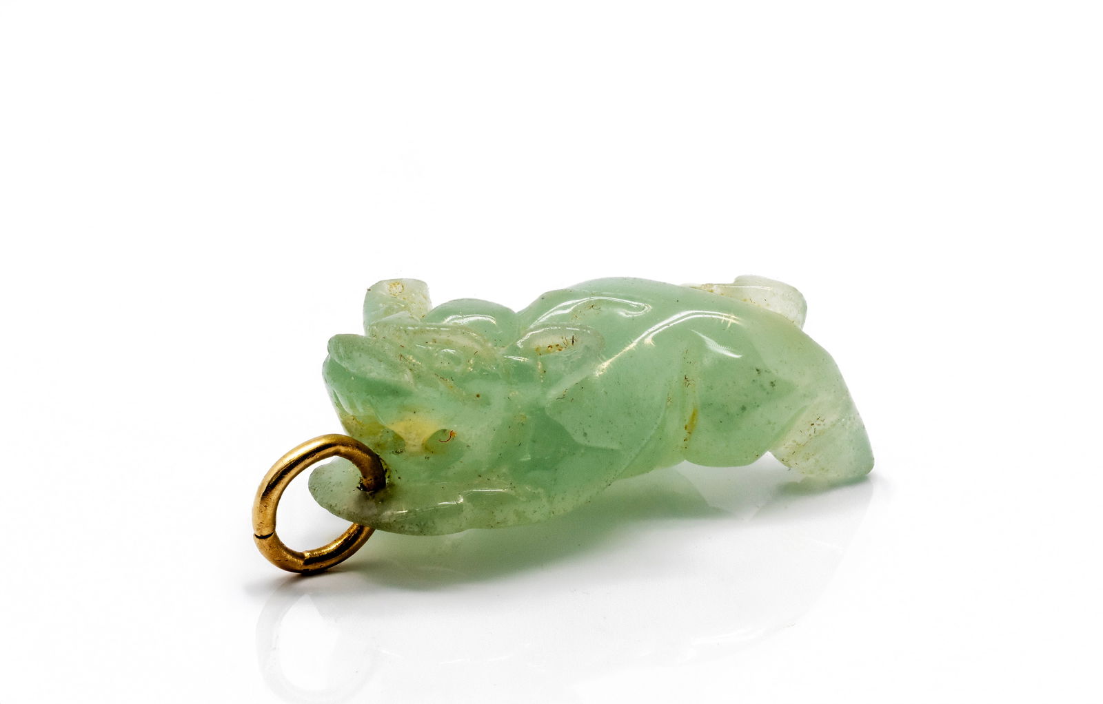Asian Carved Jade Dragon Pendant: Title: Carved Jade Dragon PendantOrigin: East Asia (likely China)Material: Carved jade with gold-tone suspension ringDimensions: 27.67 × 5.46 mmWeight: 16.48 gAdditional Information: No visible