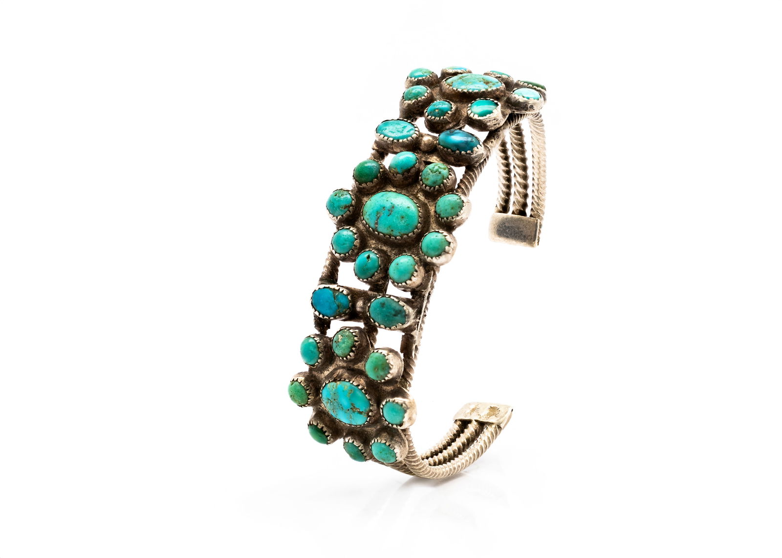 Navajo Multi-Stone Turquoise Silver Cuff Bracelet: Title: Navajo Multi-Stone Turquoise Silver Cuff BraceletOrigin: Native American, NavajoMaterial: Sterling silver with natural turquoise cabochonsSize: 6 1/2Weight: 36.05 gDescription: Handcrafted