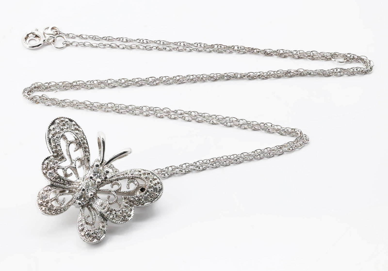 14K White Gold Diamond Butterfly Pendant/Brooch with Chain: Title: 14K White Gold Diamond Butterfly Pendant/Brooch with Chain Origin: United States Material: 14K white gold (stamped “14K BL” on both the pendant/brooch and the chain)