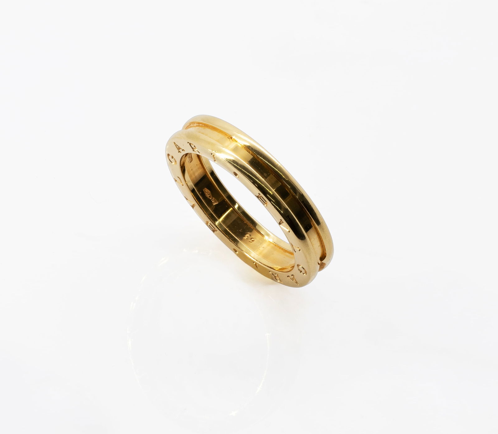 B.Zero1 One-band Ring in 18K Yellow Gold: Brand: Bvlgari B.Zero1 Material: 18K Yellow Gold Size: US 10.5 (63-XXXL) Width: 4.8 mm Weight: 7.76 grams Hallmarks: