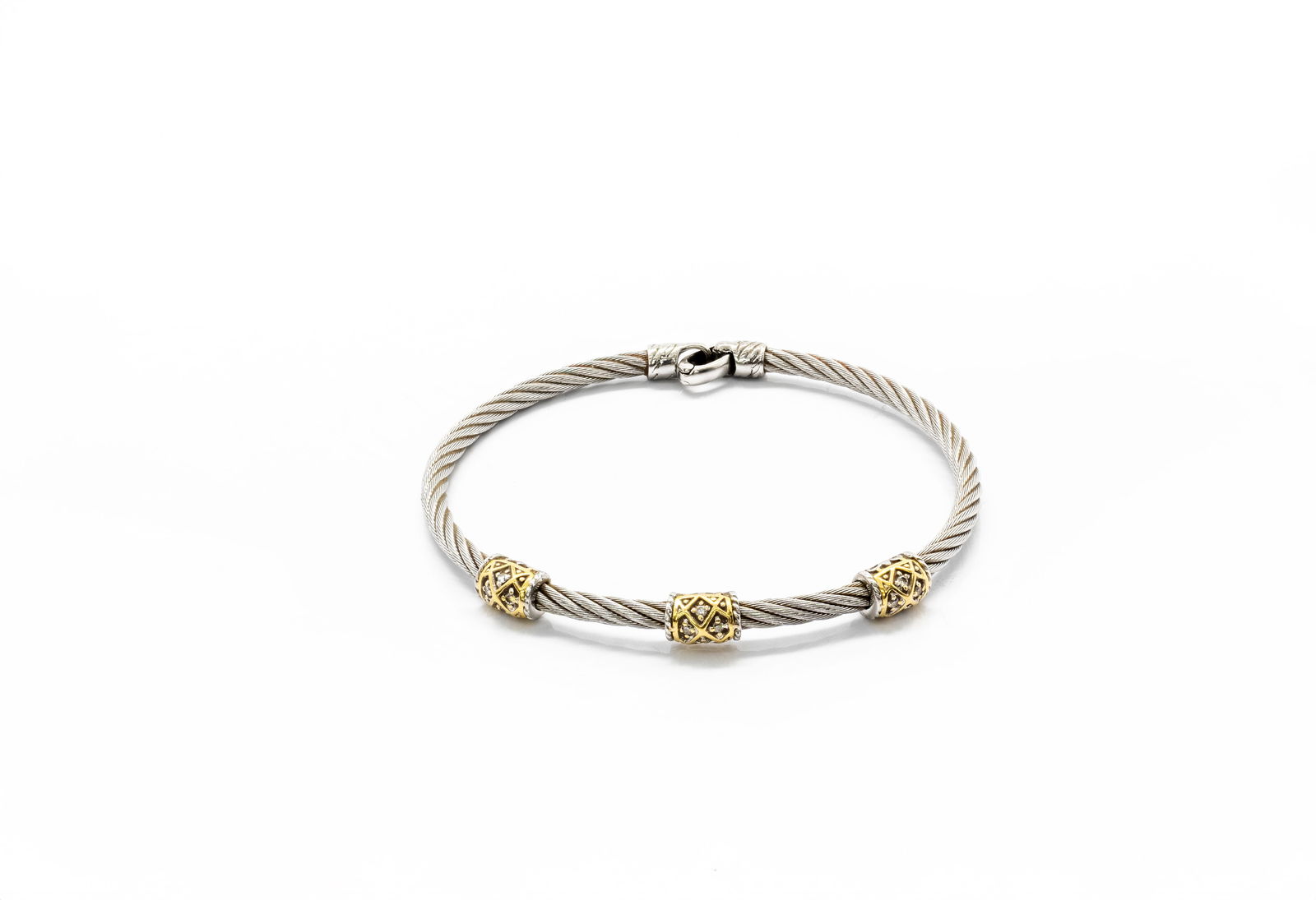 Charriol 18K Gold & Stainless Steel Diamond Three-Station Cable Bangle Bracelet: Title: Charriol 18K Gold & Stainless Steel Diamond Three-Station Cable Bangle Bracelet Origin: Switzerland. Material: Stainless steel cable bracelet with 18K yellow gold accents (AU 75