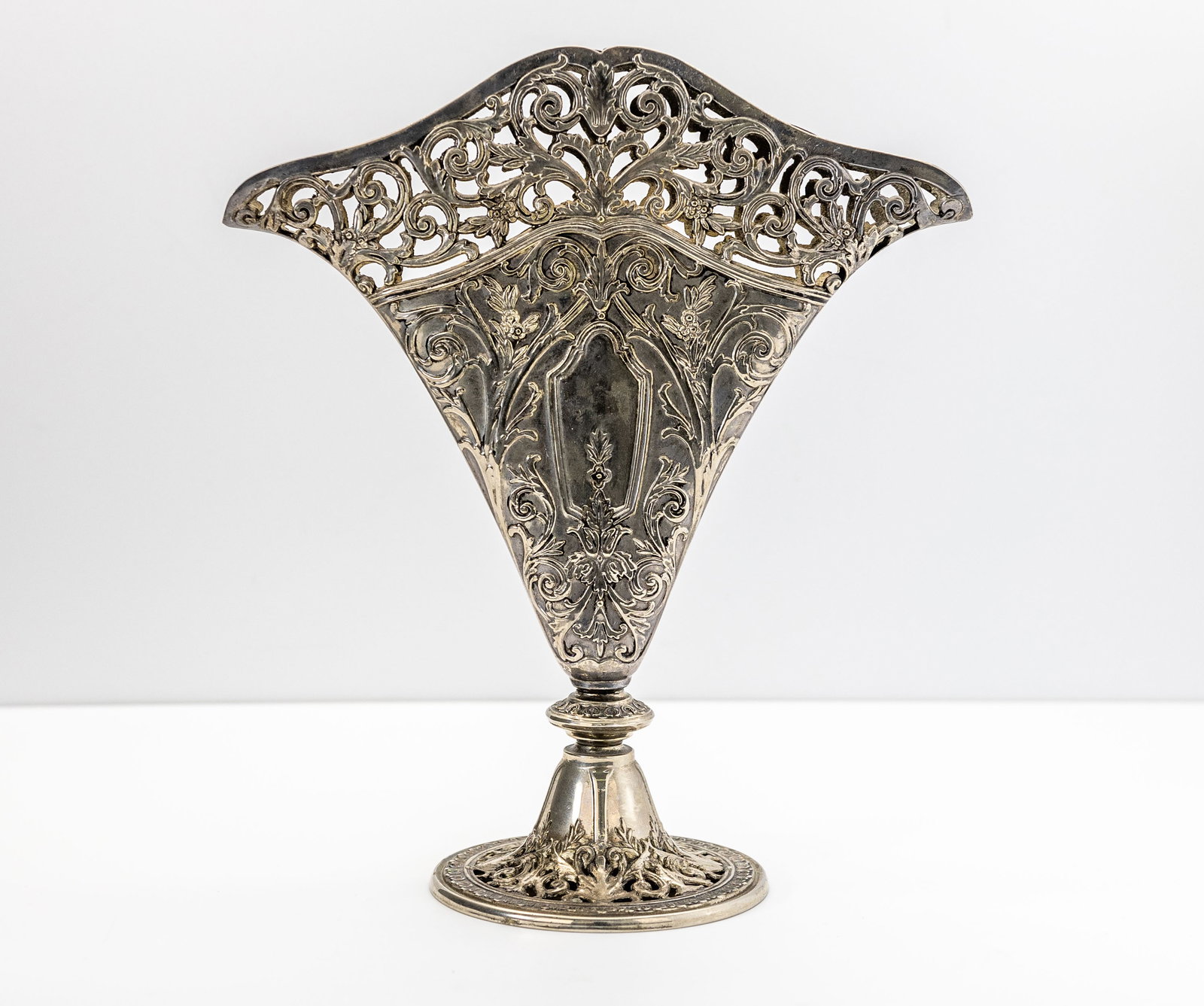 Ornate Victorian Silver Plated Pierced Filigree Vase: Title: Ornate Victorian Silver-Plated Pierced Filigree Fan Vase Origin: Probably European or American, Late 19th to Early 20th Century Material: Silver-Plated Metal Measu