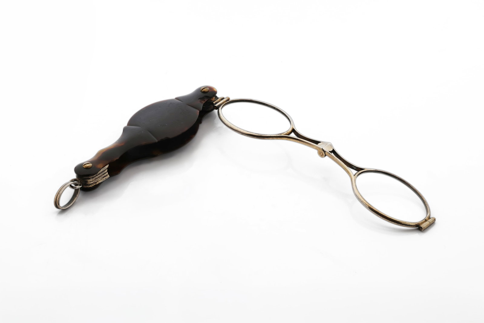 Antique Faux Tortoiseshell Folding Lorgnette Opera Glasses: Description: Antique Victorian folding lorgnette featuring a faux tortoiseshell handle with a metal frame. Designed for use at the opera, theater, and other formal social occasions. The piece is fitte