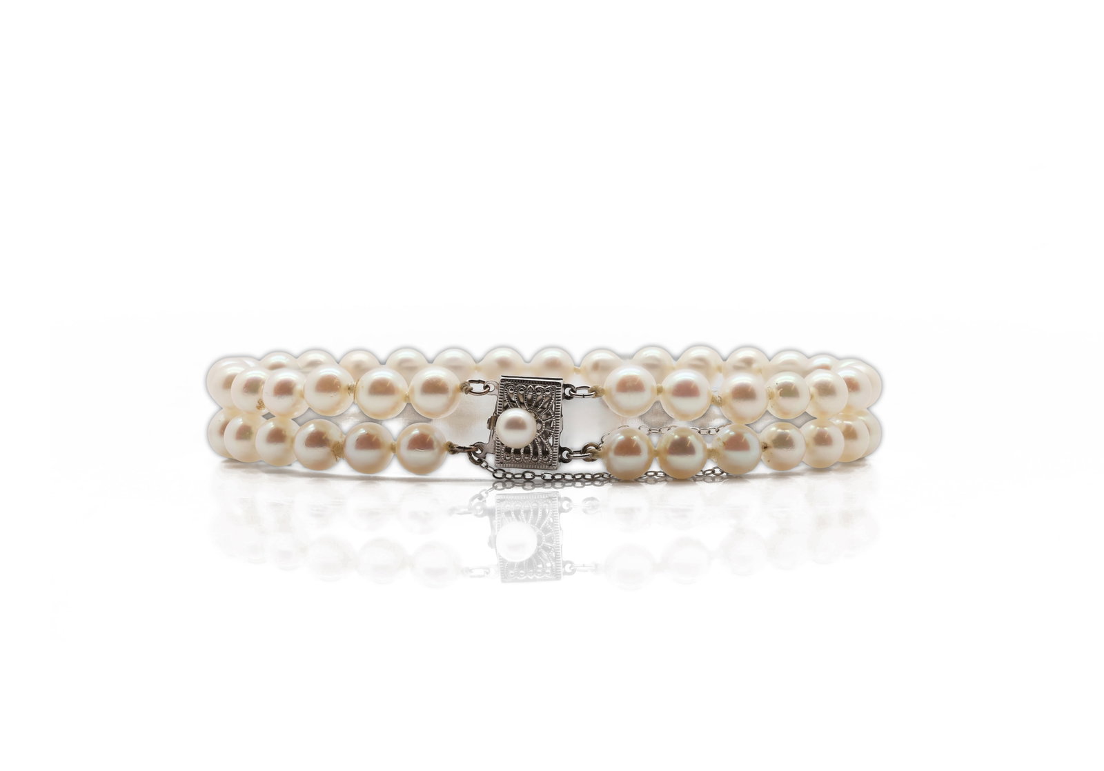 Double-Strand Cultured Pearl Necklace with 14K White Gold Filigree Clasp: Title: Double-Strand Cultured Pearl Necklace with 14K White Gold Filigree Clasp Material: Cultured pearls and 14K white gold clasp Mark: Clasp stamped 14K Length: