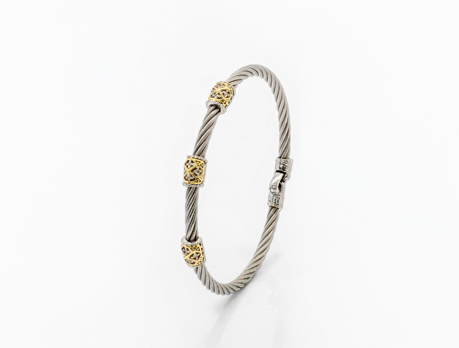 Charriol 18K Gold & Stainless Steel Diamond Three-Station Cable Bangle Bracelet: Title: Charriol 18K Gold & Stainless Steel Diamond Three-Station Cable Bangle Bracelet Origin: Switzerland. Material: Stainless steel cable bracelet with 18K yellow gold accents (AU 75
