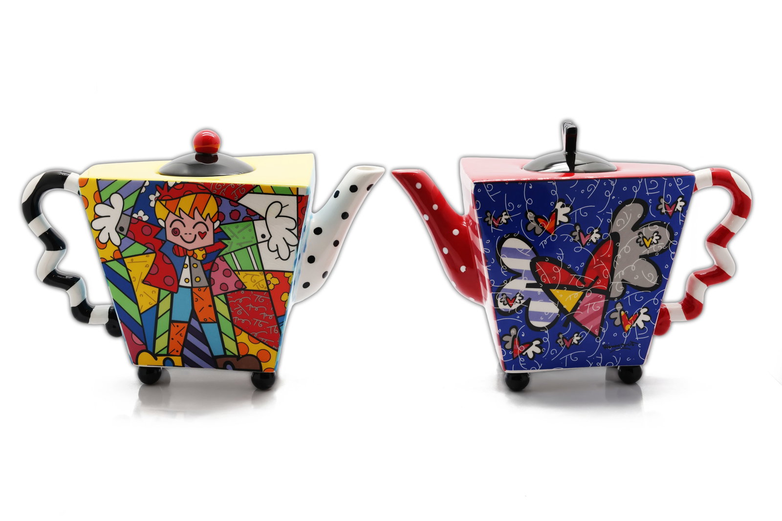 Romero Britto for Giftcraft Pop Art Ceramic Teapots, Pair: Title: Romero Britto for Giftcraft Pop Art Ceramic Teapots, Pair Circa: 2013. Manufacturer: Giftcraft Material: Glazed ceramic Origin: Made in