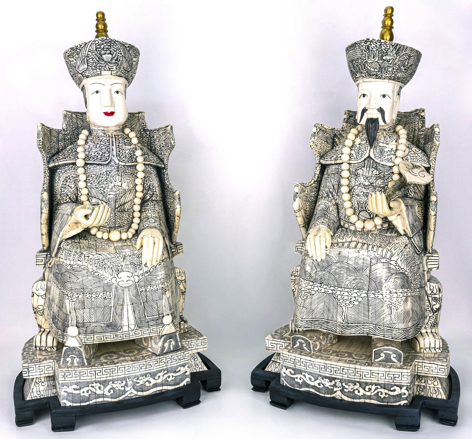 Qing Dynasty Tusk Material Tile Emperor & Empress Statues: Title: Qing Dynasty Tusk Material Tile Emperor & Empress Statues & Empress Statues Description: An impressive pair of finely carved statues depicting the Emperor and Empress, each intricately detailed