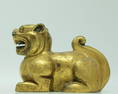 An Archaic Gilt-Bronze Auspicious Beast