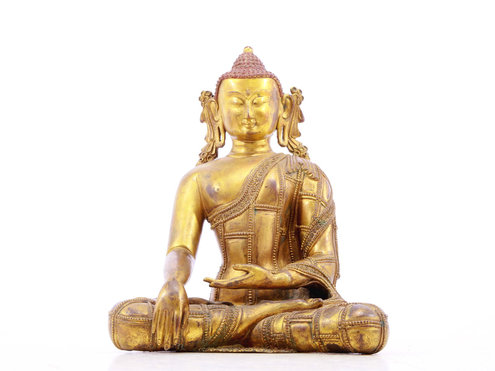 A solemn gilt bronze statue of Gautama Buddha (1 of 10)