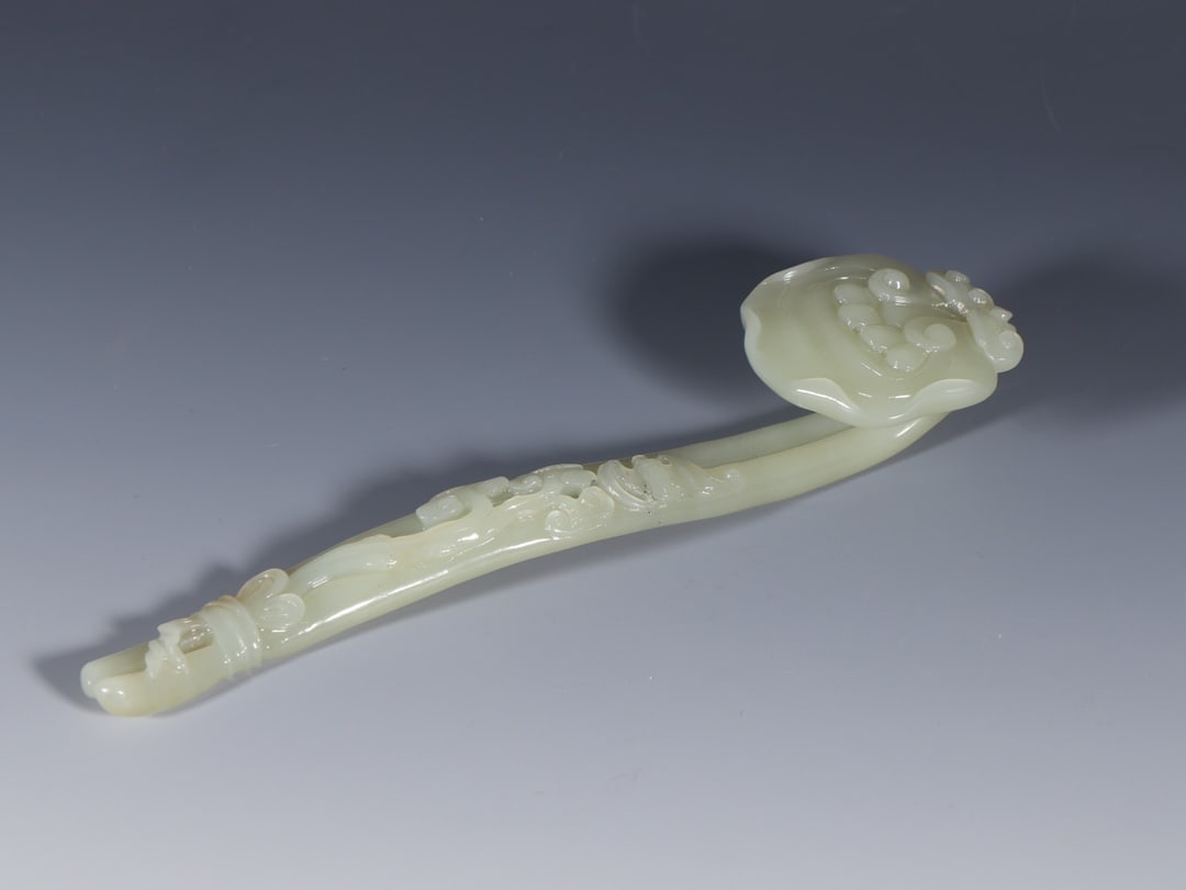 A Rare White Jade Bats and Peach Pattern Ruyi Ornament (1 of 9)