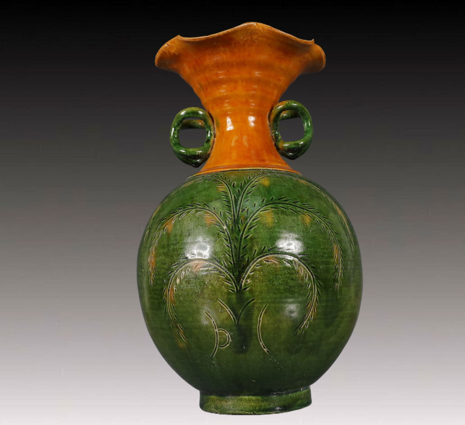 A Rare Tang Tri-Color Glazed Pottery Flower Pattern Double-Ears Vase: A Rare Tang Tri-Color Glazed Pottery Flower Pattern Double-Ears Vase,Tang Dynasty, China,Size:19cmx19cmx30cm,Weight:1600g 唐三彩花卉纹双耳瓶ᦁ