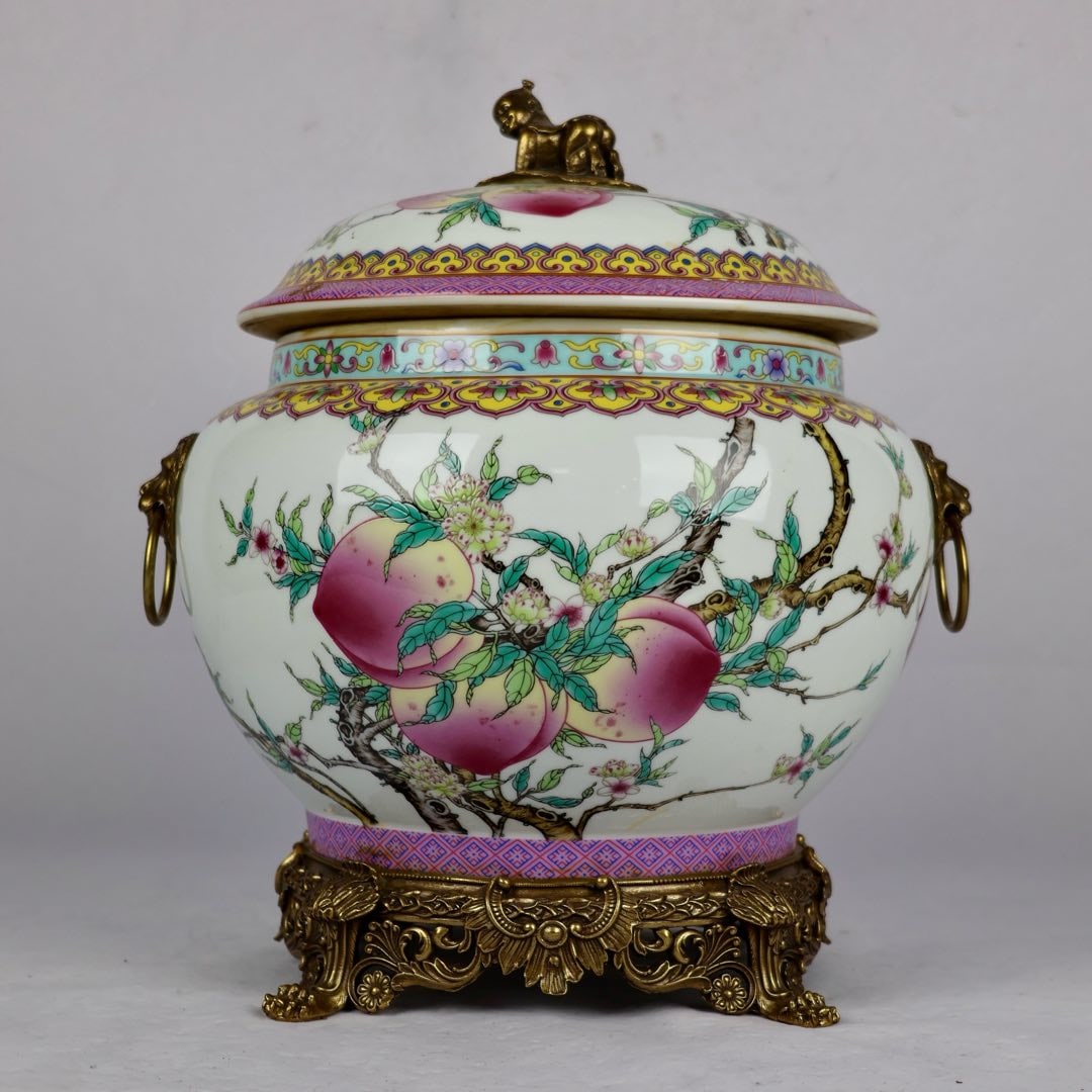 A Exquisite Famille-Rose Inlaid Coppery Flower and Fruit Pattern Double-Ears Jar : A Exquisite Famille-Rose Inlaid Coppery Flower and Fruit Pattern Double-Ears Jar Qing Dynasty, China Qianlong Four-character Mark Size:37cmx32cm粉彩寿桃镶铜狮
