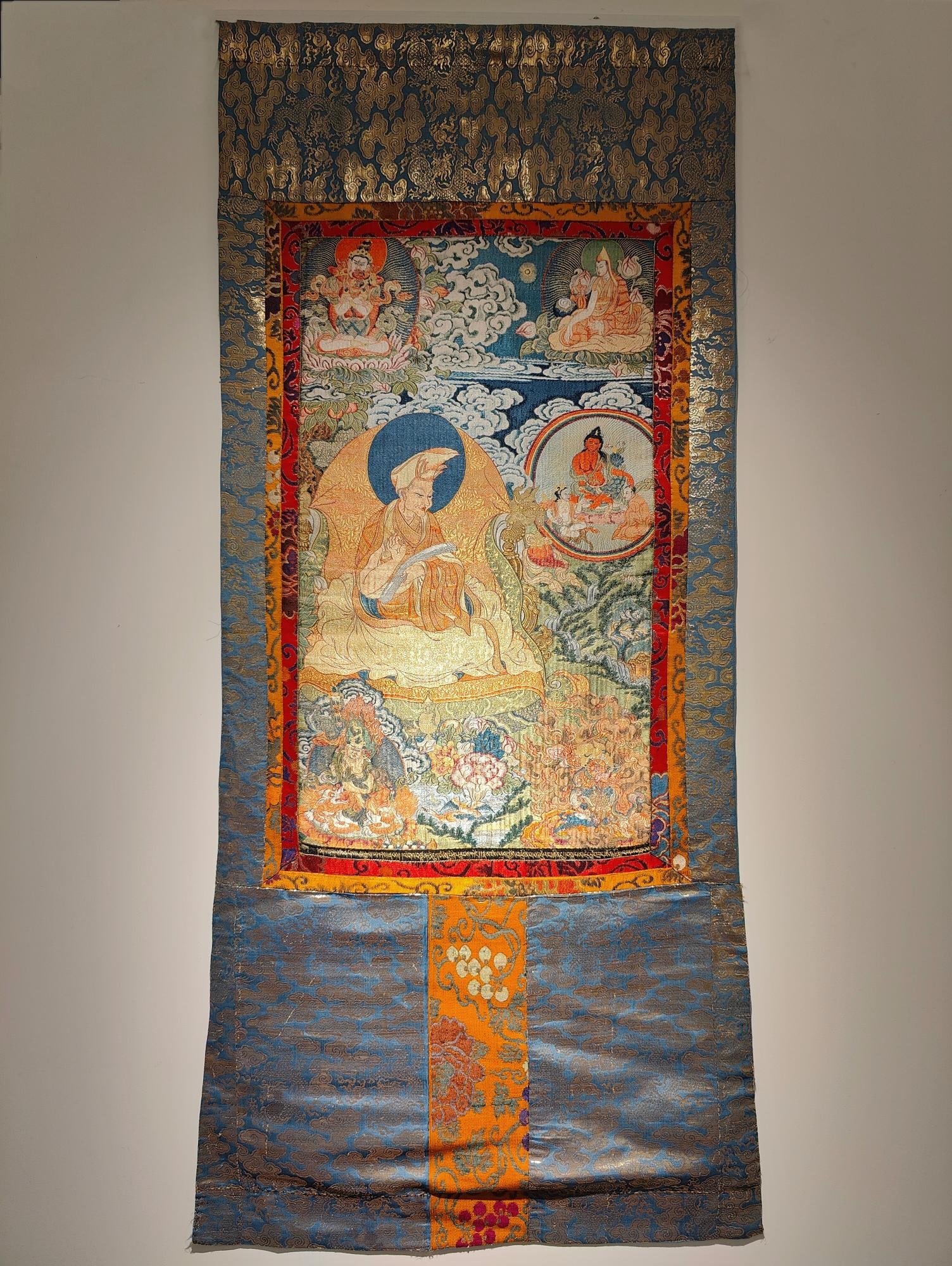 Thangka of the Fourth Panchen Lama in Palace Brocade: Palace Brocade Thangka of the Fourth Panchen Lama in the Qing Dynasty. This Thangka has the theme of the Fourth Panchen Lama and was made using court brocade weaving techniques. The fourth Panchen Lam
