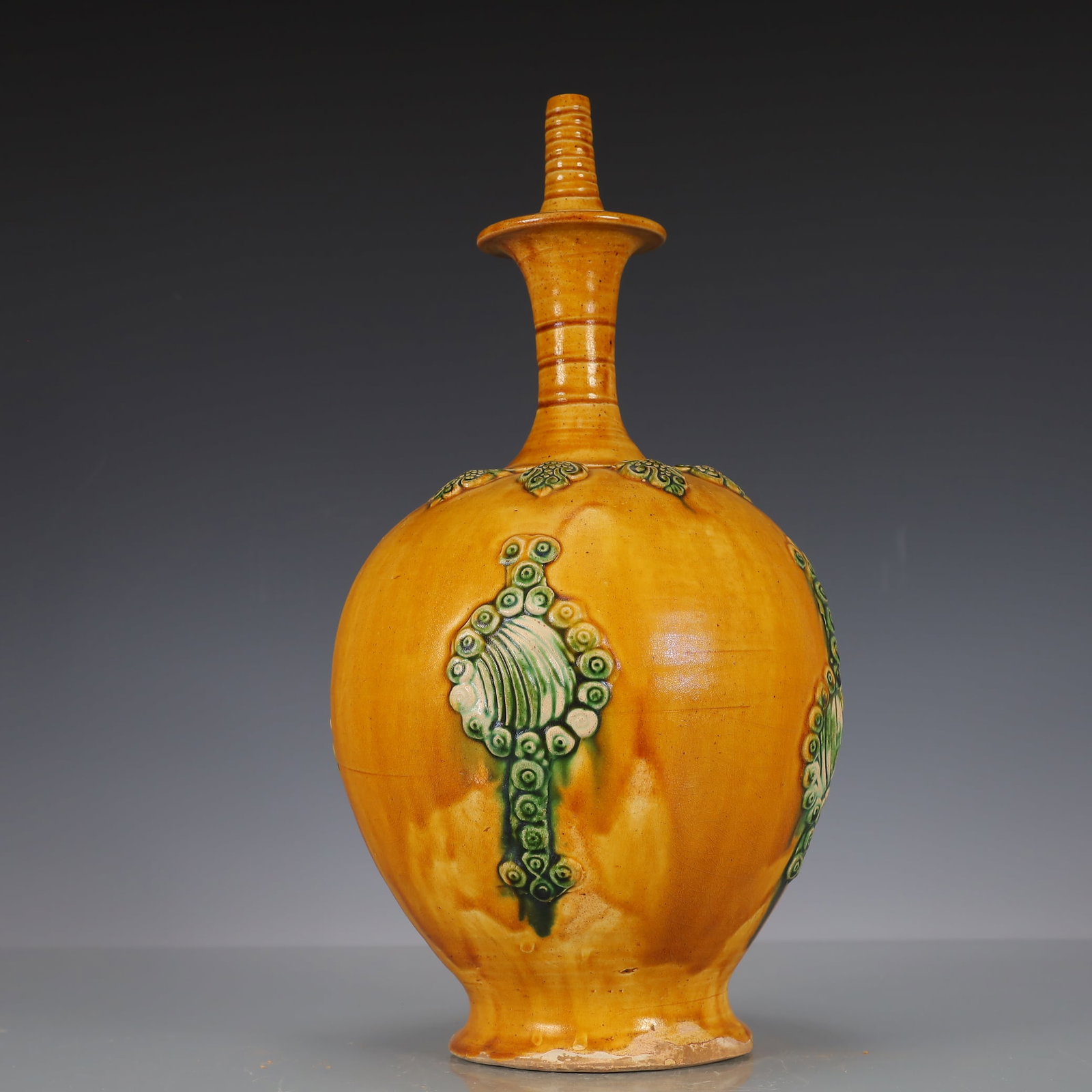 A Exquisite Trio-colored glazed pottery of the Tang Dynasty Flower Pattern Vase : A Exquisite Trio-colored glazed pottery of the Tang Dynasty Flower Pattern Vase Tang Dynasty, China Size:18cmx18cmx34cm Weight:1700g唐三彩花卉纹瓶 中