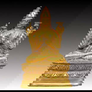 An Excellent Gilt-Bronze Figure Of Tsongkapa: An Excellent Gilt-Bronze Figure Of Tsongkapa. The figure with a dignified expression is rendered clad in long,flowing robes,the voluminous drapery elegantly cascading in folds,topknot surmounted by a