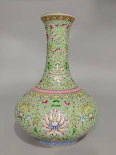 An Exquisite Famille-Rose Lotus Pattern Vase: An Exquisite Famille-Rose Lotus Pattern Vase Qing Dynasty, China Qianlong Six-character Mark Size:11.8inx8.7in粉彩缠枝莲图案长径瓶