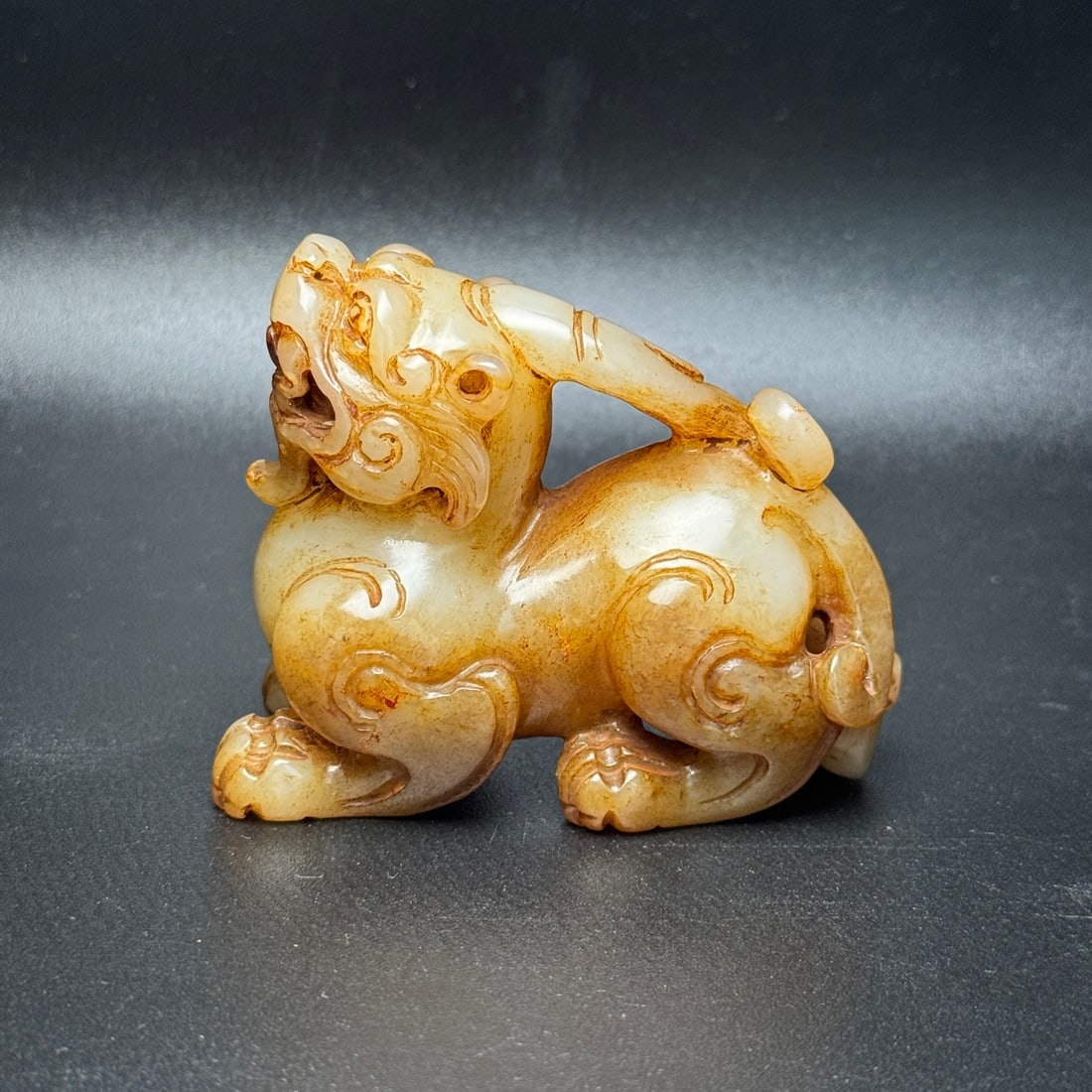 An Exquisite Gaogu Jade Auspicious Beast Hand Piece (1 of 7)