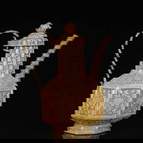 An Exquisite Gilt Silver Lotus Pattern Ewer: An Exquisite Gilt Silver Lotus Pattern Ewer,Tang Dynasty,China,Zhenguan Four-Character Mark,Size:5.1inx3.5inx6.3in,Weight:700g 银鎏金缠枝莲纹执壶,