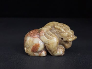 An Exquisite White Jade Auspicious Beast Ornament