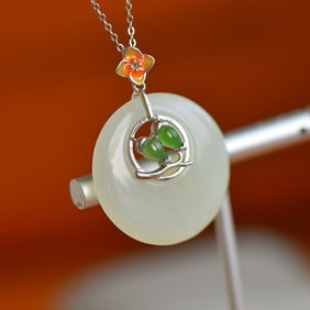 An Exquisite Silver Inlaid White Jade Pendant