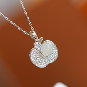 An Exquisite Silver Inlaid White Jade Pendant