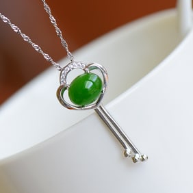 An Exquisite Silver Inlaid Jasper Pendant