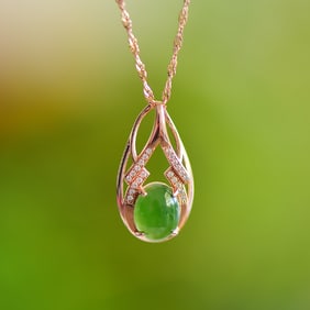 An Exquisite Gilt Silver Inlaid Jasper Pendant