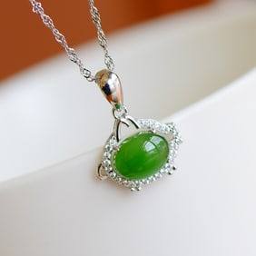 An Exquisite Silver Inlaid Jasper Pendant