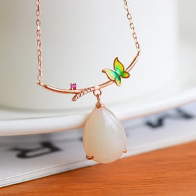 An Exquisite Silver Inlaid White Jade Pendant