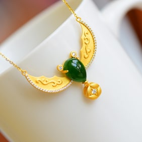 An Exquisite Gilt Silver Inlaid Jasper Pendant