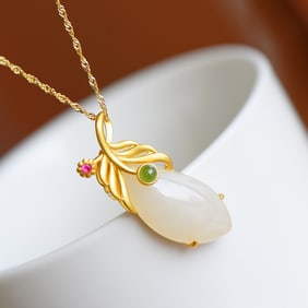 An Exquisite Gilt Silver Inlaid White Jade Pendant