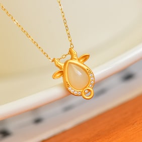 An Exquisite Gilt Silver Inlaid White Jade Pendant