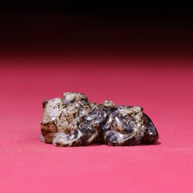 A Rare White Jade Auspicious Beast Pendant