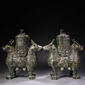 A pair of Rare Bronze Double-faced Beast Zun
