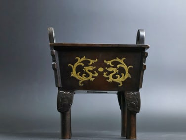 A Rare Red Copper Gilt Four-Footed Straight-Ears Ding