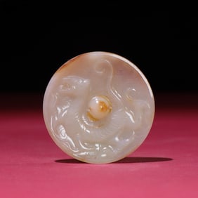 A Rare White Jade Tiger Looking Glass