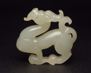 A Rare Hetian Jade Auspicious Beast-Shaped Pendant