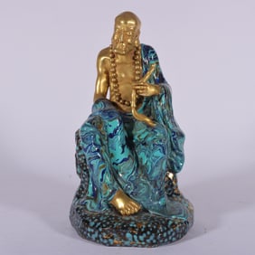 A Rare Robin's-Egg-Glazed Gilt Bronze Arhat Sitting Statue