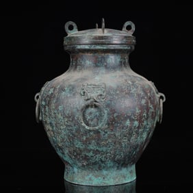 An Archaic Bronze Inscription Beast-Ears Cover Jar