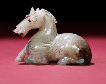 An Exquisite White Jade Painted Gold Horse Ornament