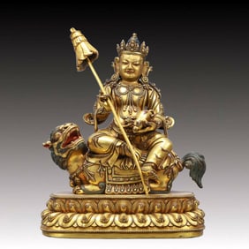 A Solemn Gilt Bronze Statue of Mammon Rides the Lion