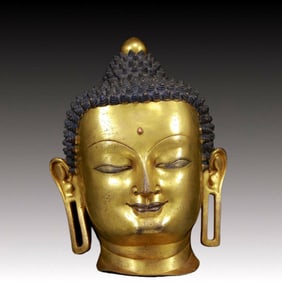 A Brilliant Gilt-Bronze Head Of Buddha Shakyamuni