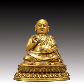 A Solemn Gilt Bronze Statue of Guru